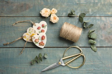 Flat lay composition with scented sachets on blue wooden table