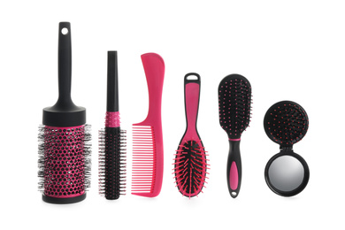 Photo of Set of professional hair brushes and comb isolated on white, top view