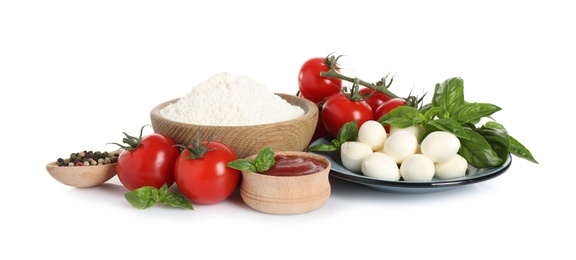 Photo of Fresh ingredients for pizza on white background