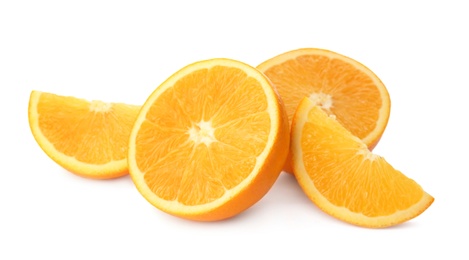 Cut fresh ripe oranges on white background