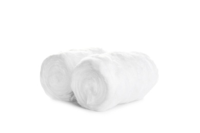 Photo of Rolls of fluffy cotton on white background