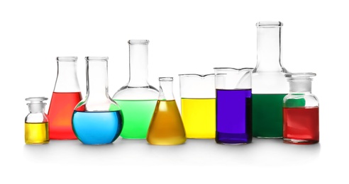 Laboratory glassware with different samples on white background. Solution chemistry