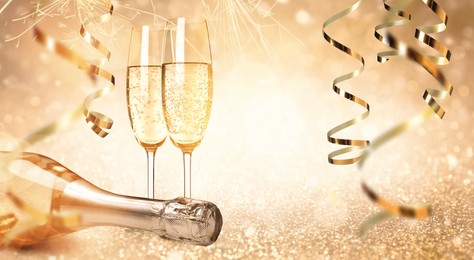 Glasses and bottle of sparkling wine on bright festive background, banner design