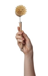 Photo of Woman holding eco friendly brush for dish washing on white background, closeup. Conscious consumption