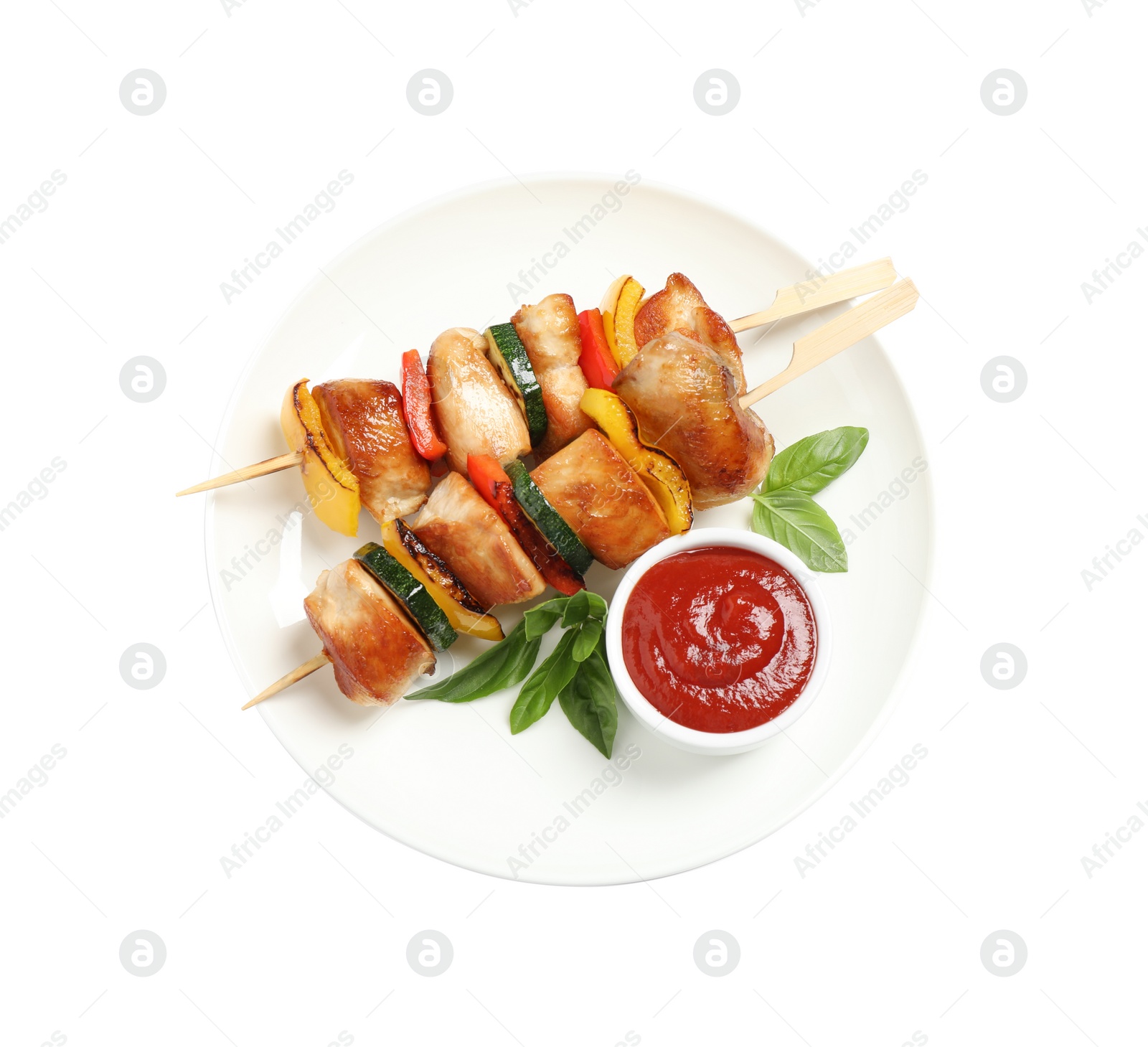 Photo of Delicious chicken shish kebabs with vegetables and ketchup on white background, top view