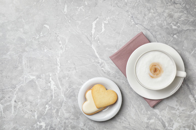 Photo of Flat lay composition with coffee on grey marble table, space for text. Tasty breakfast