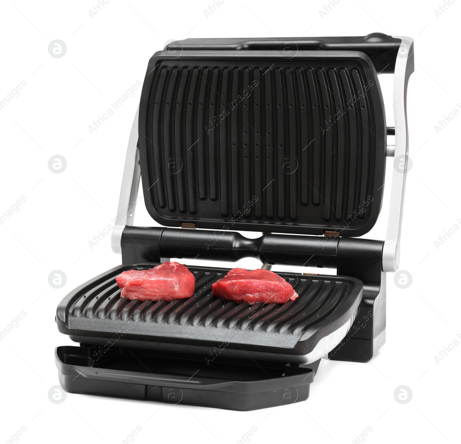 Photo of Electric grill with raw meat steaks isolated on white