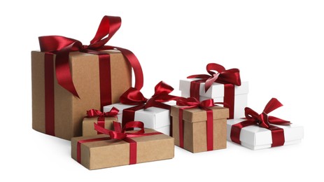 Photo of Different Christmas gifts in boxes on white background