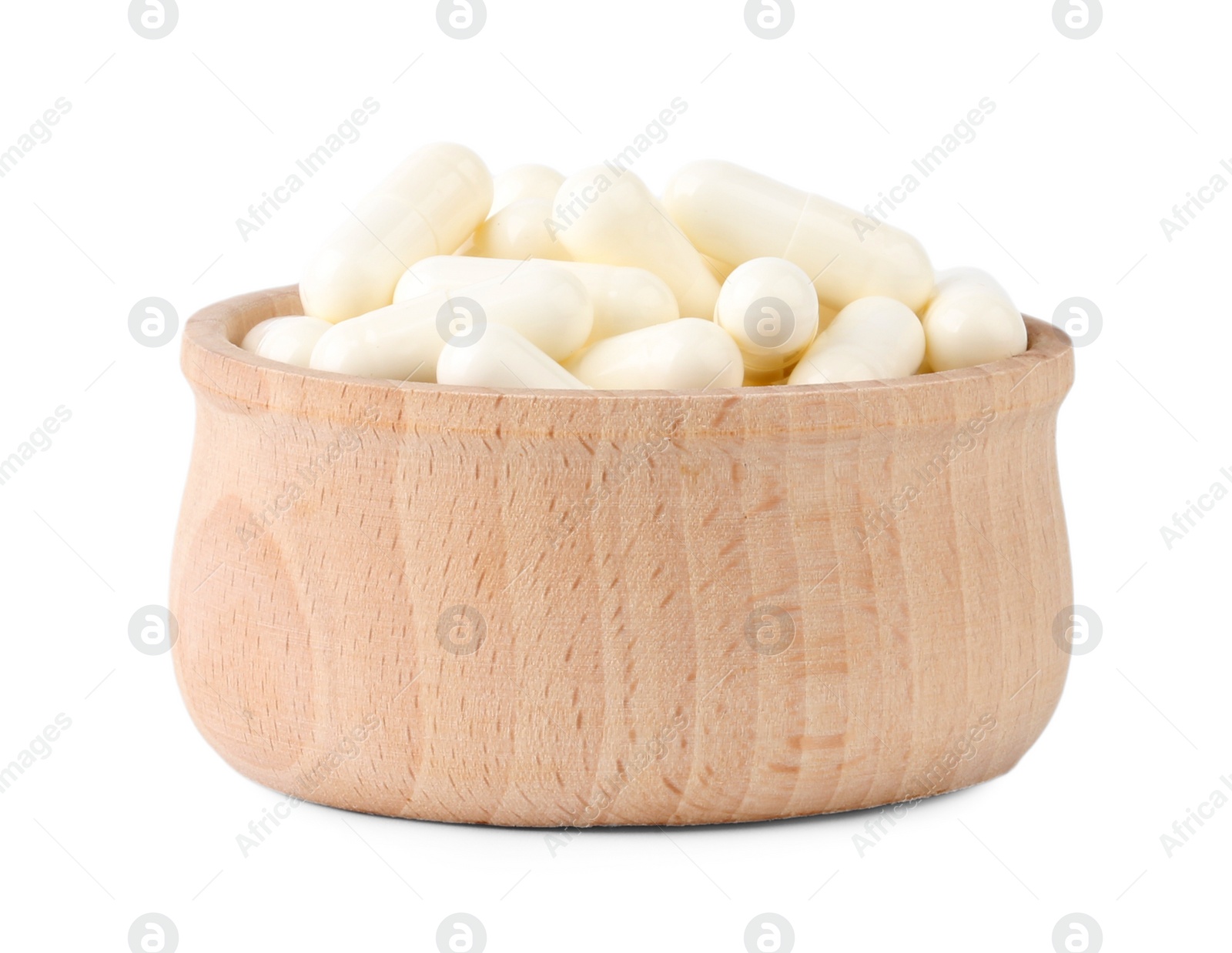 Photo of Vitamin capsules in wooden bowl isolated on white