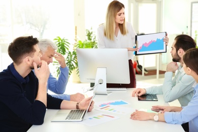 Photo of Office employees having argument during business meeting