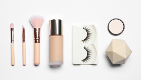 Photo of Set of makeup products on white background, top view