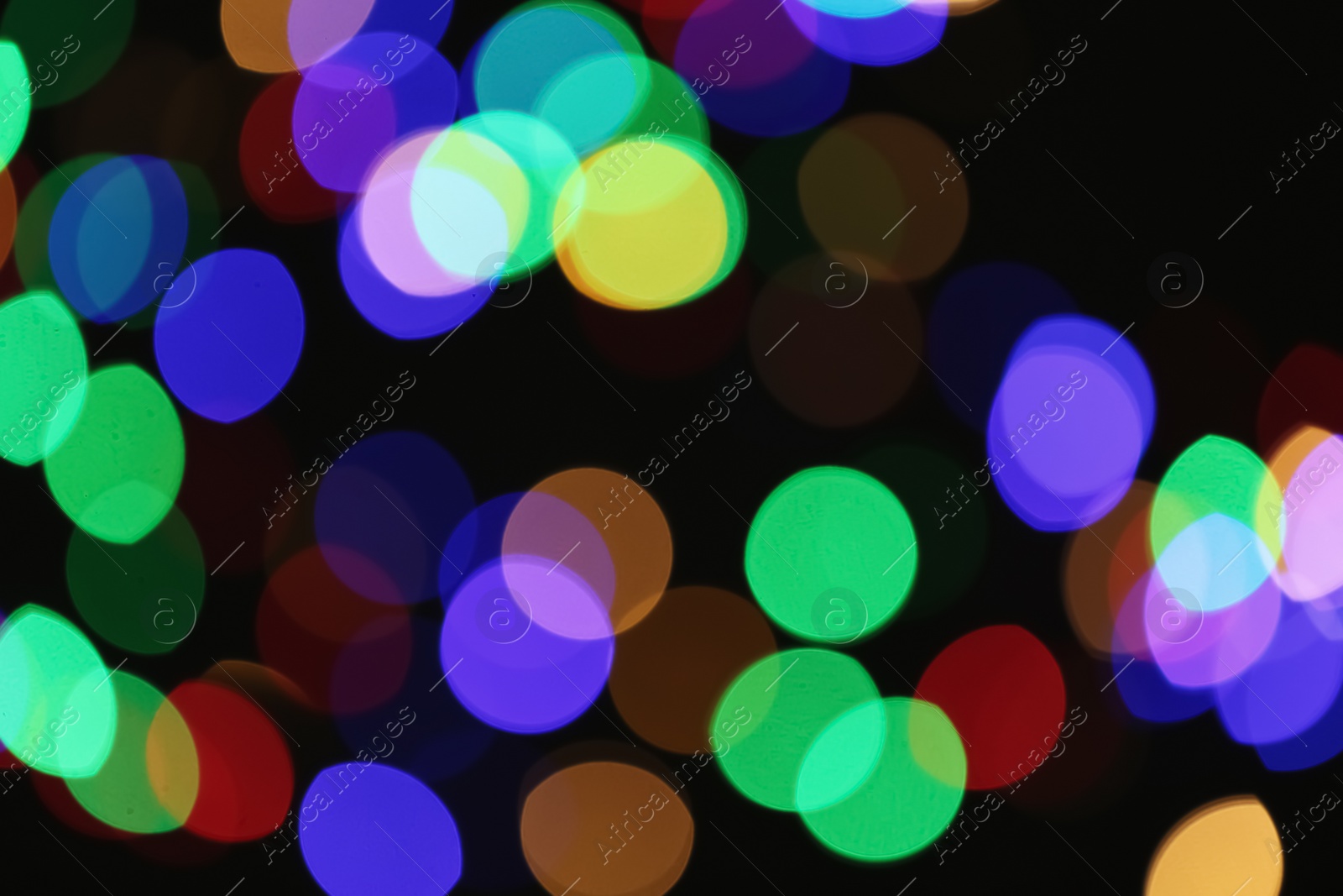 Photo of Beautiful colorful lights on dark background. Bokeh effect