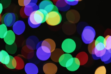 Photo of Beautiful colorful lights on dark background. Bokeh effect