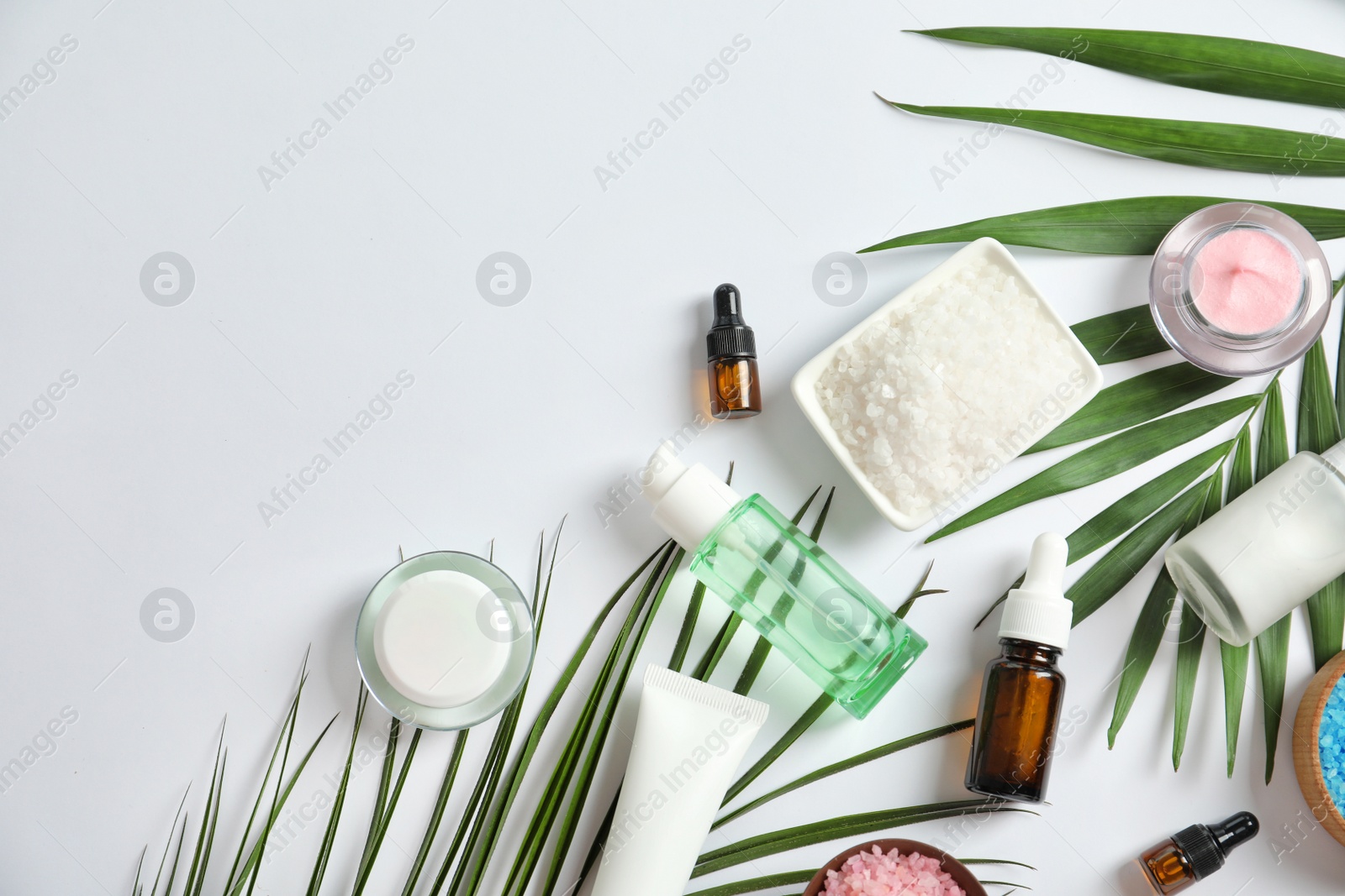 Photo of Flat lay composition with cosmetic products on white background