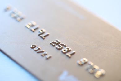 One credit card on light background, macro view