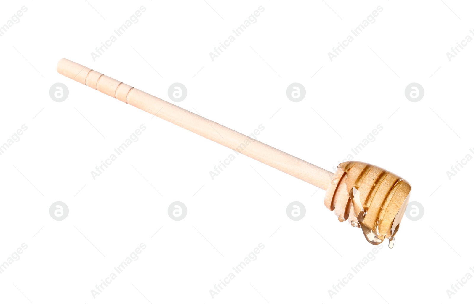 Photo of Natural honey dripping from dipper on white background