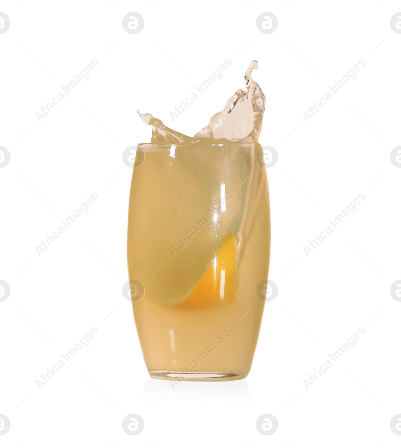 Photo of Lemon slice falling into glass of juice on white background