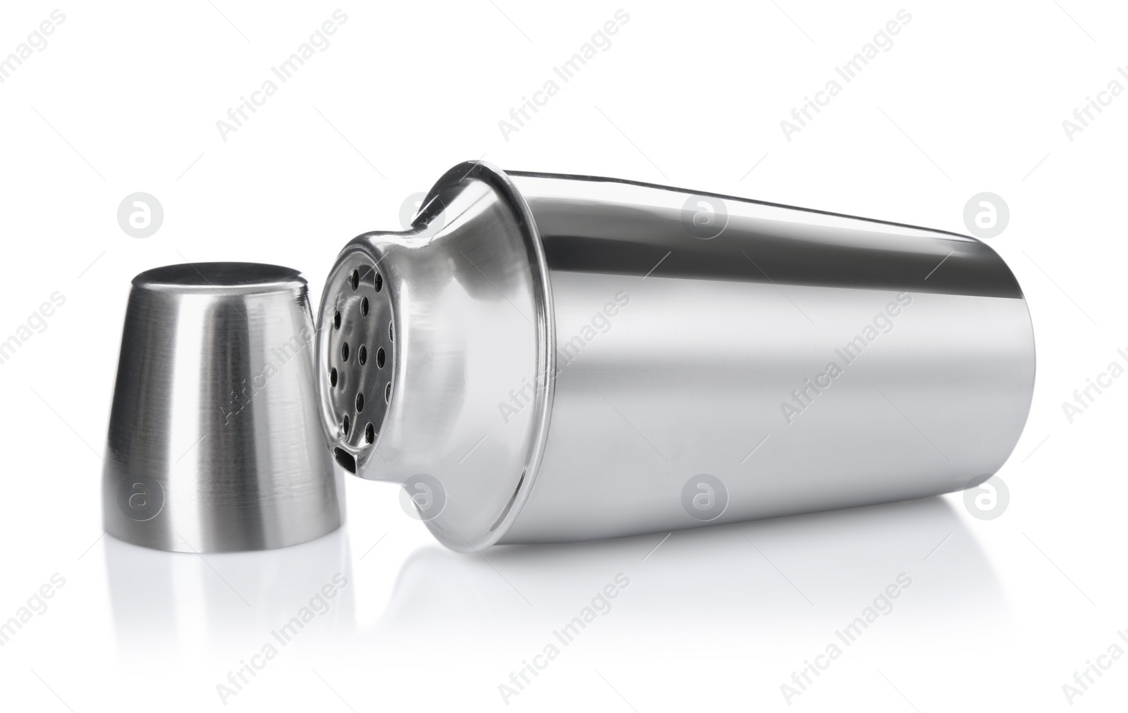 Photo of Metal cocktail shaker and cup isolated on white