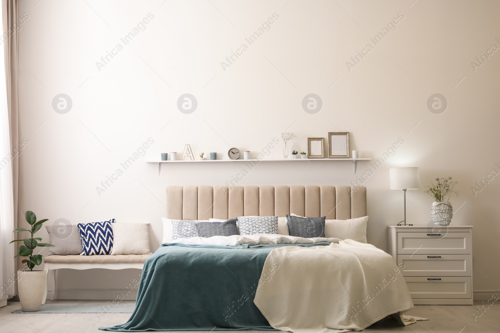 Photo of Comfortable bed with pillows in room. Stylish interior design