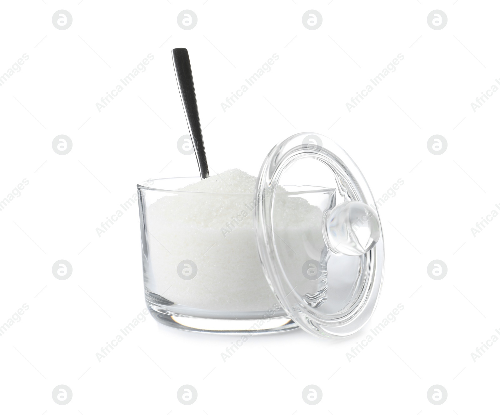 Photo of Glass bowl with sugar and spoon isolated on white