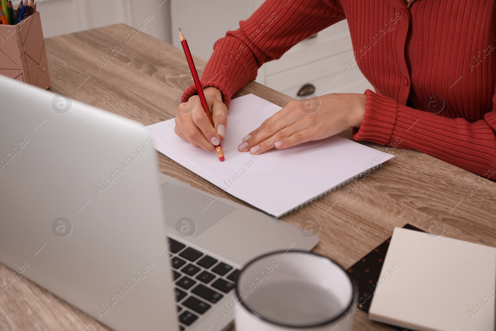 Photo of Woman drawing picture at online art lesson indoors, closeup. Distant learning