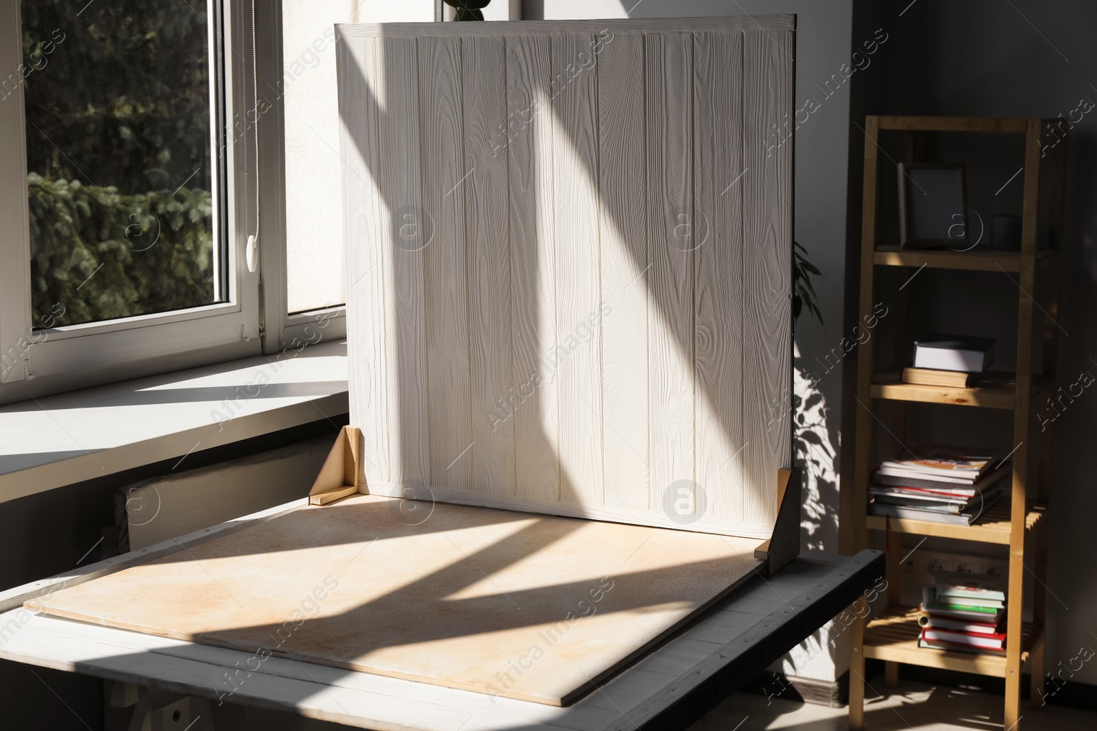 Photo of Double-sided backdrop on table in photo studio