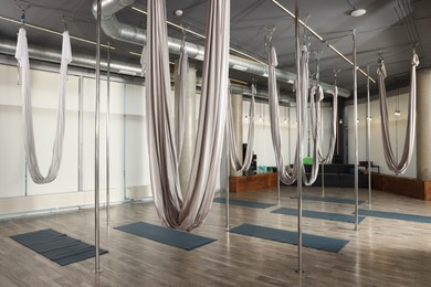 Photo of Many hammocks for fly yoga in studio