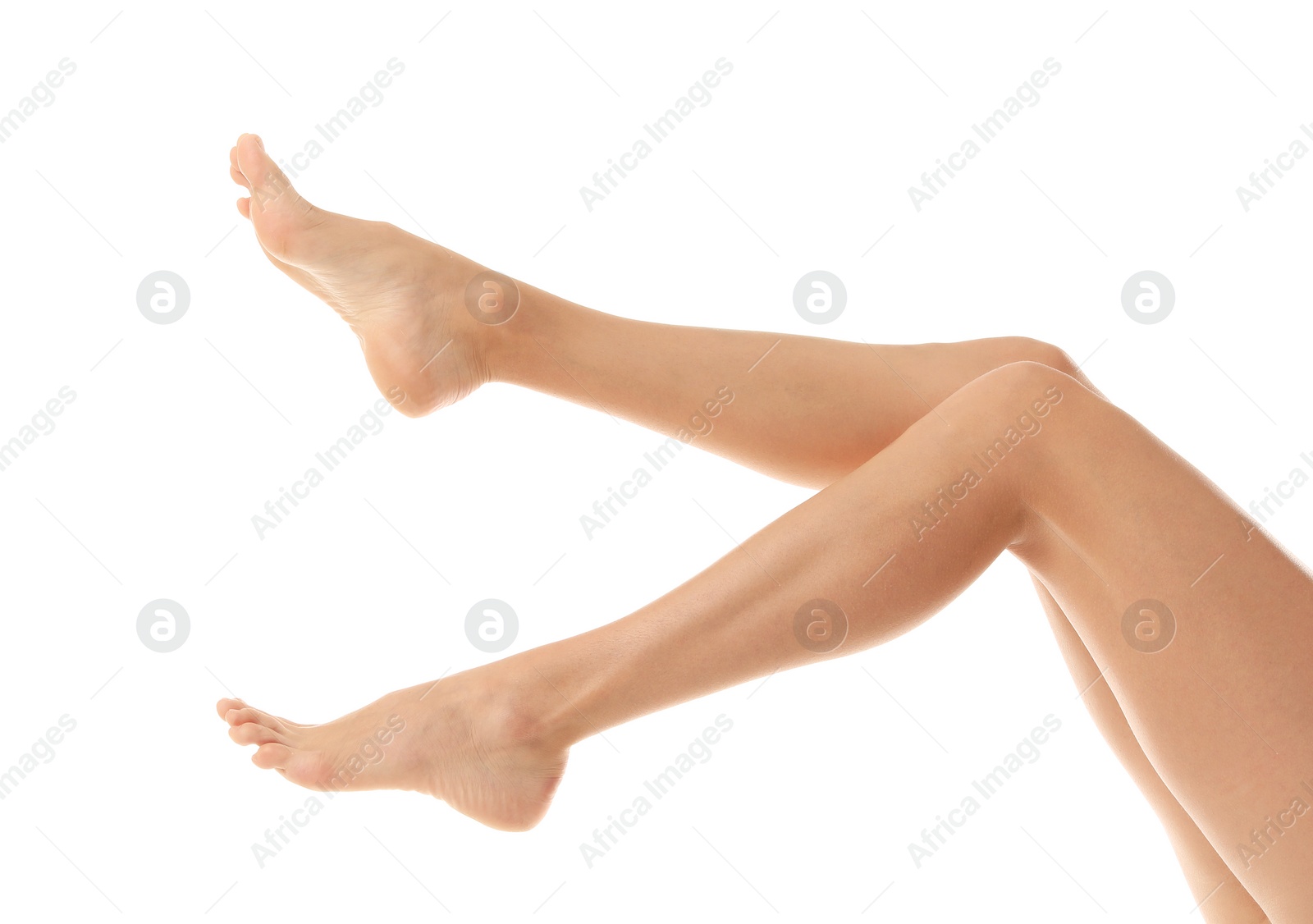 Photo of Young woman with beautiful long legs on white background, closeup