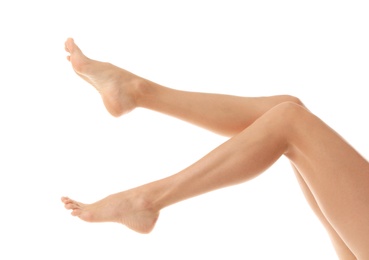 Photo of Young woman with beautiful long legs on white background, closeup