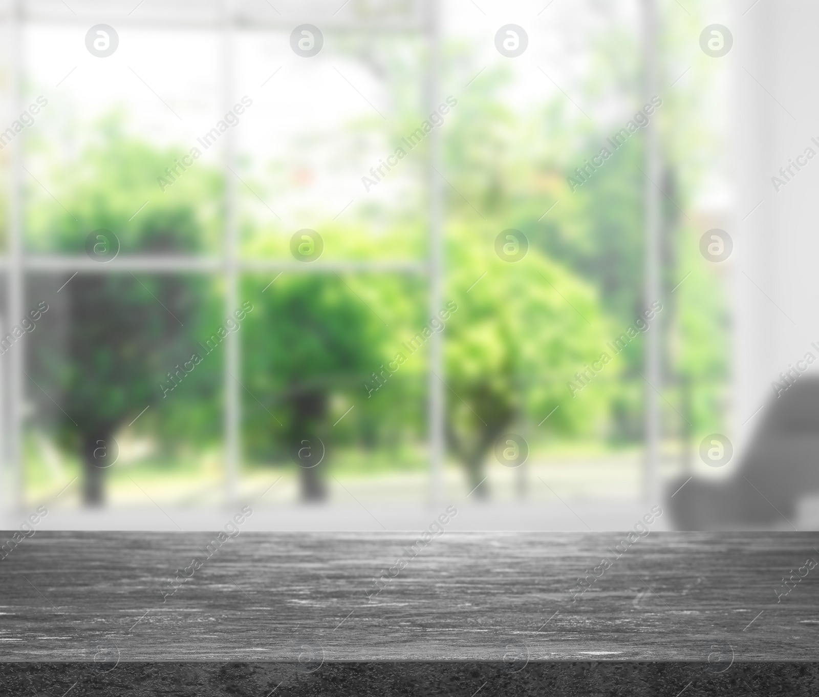 Image of Empty grey stone surface and blurred view of modern window 