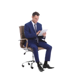 Young businessman with tablet sitting in comfortable office chair on white background