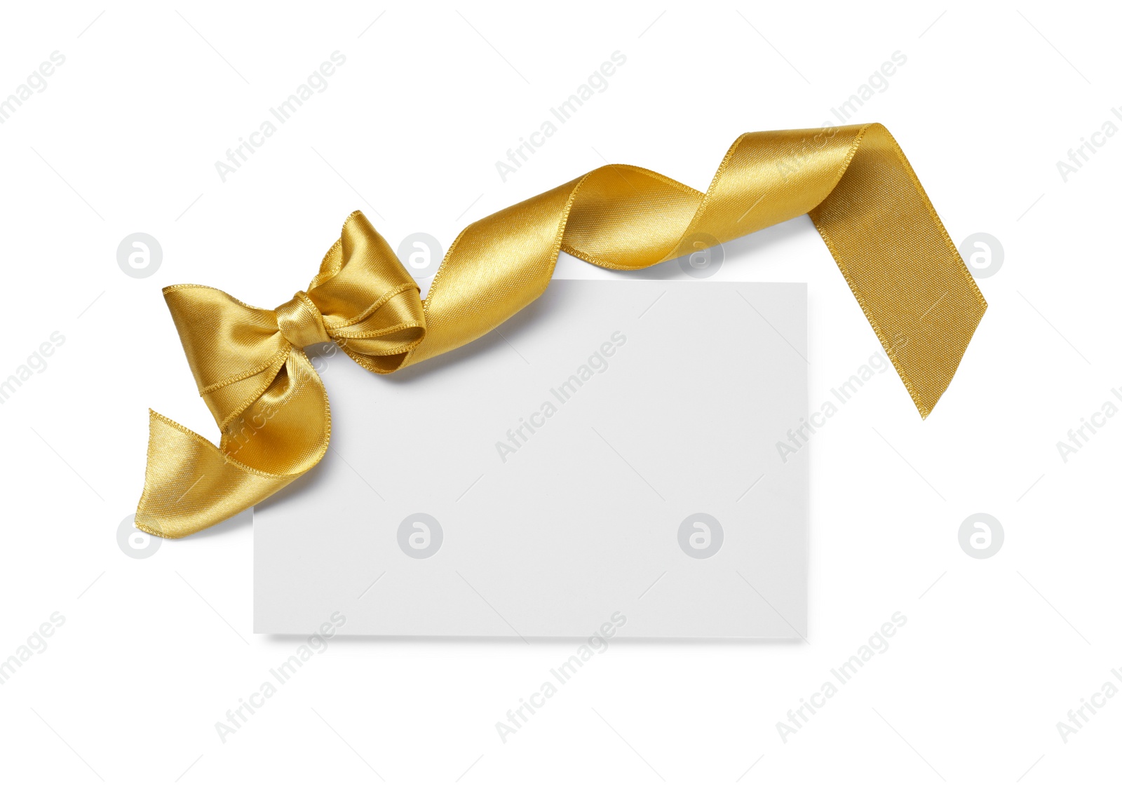 Photo of Blank gift card with golden bow isolated on white, top view