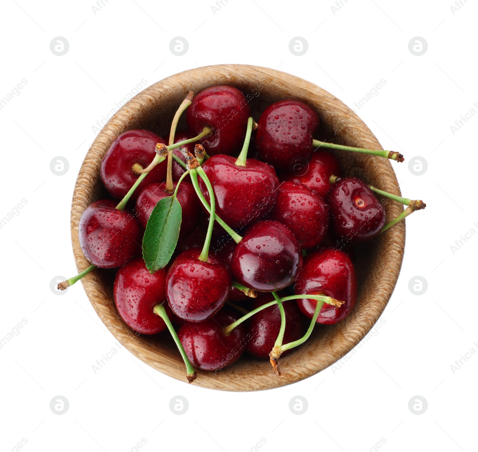 Photo of Tasty ripe sweet cherries in wooden bowl on white background, top view