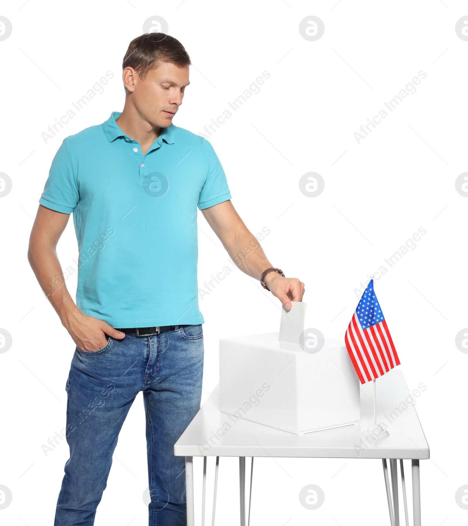 Photo of Man putting ballot paper into box against white background