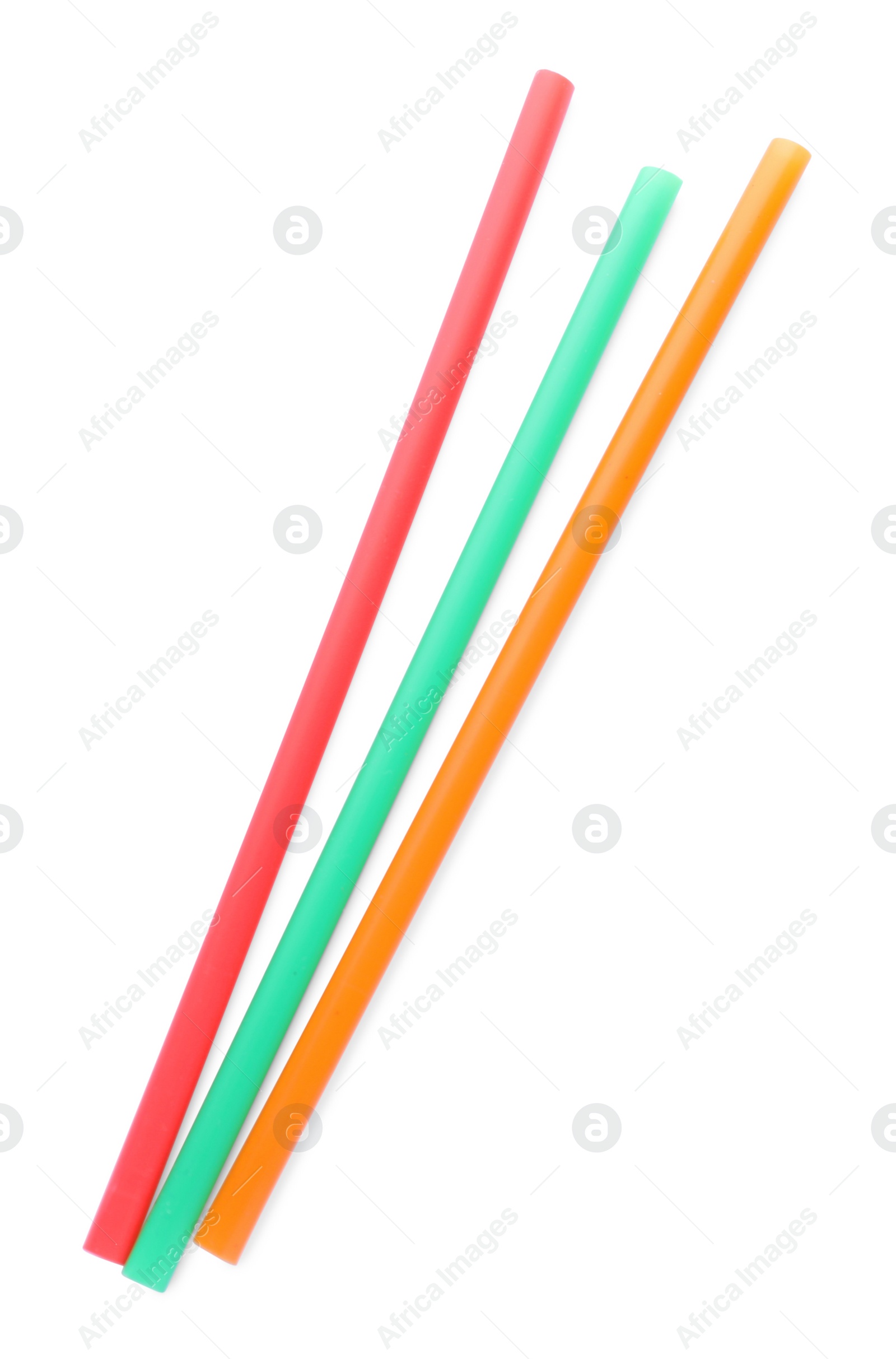 Photo of Color plastic cocktail tubes on white background