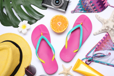 Photo of Flat lay composition with beach objects on white background