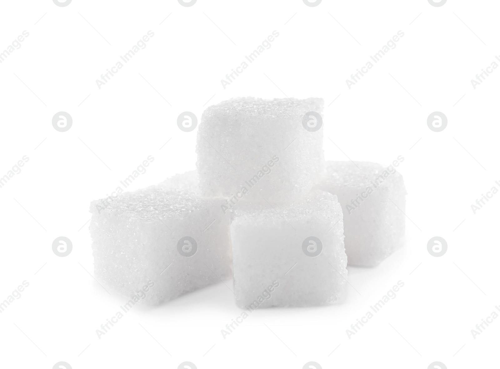 Photo of Pile of sugar cubes on white background