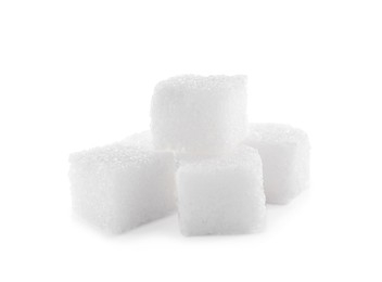 Pile of sugar cubes on white background