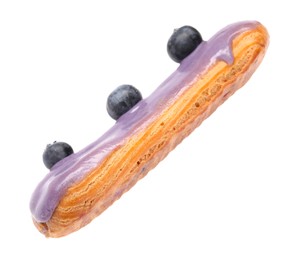 Photo of Delicious eclair decorated with blueberries isolated on white