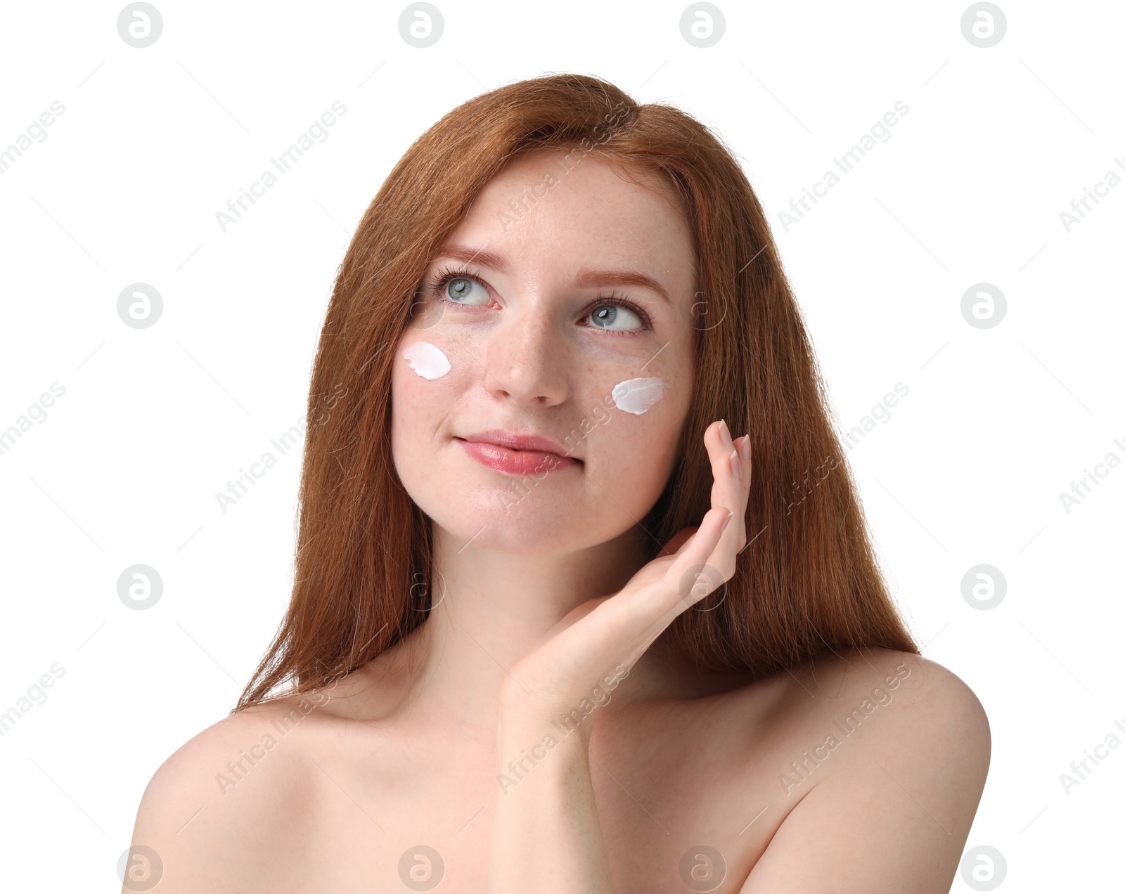 Photo of Beautiful woman with freckles and cream on her face against white background