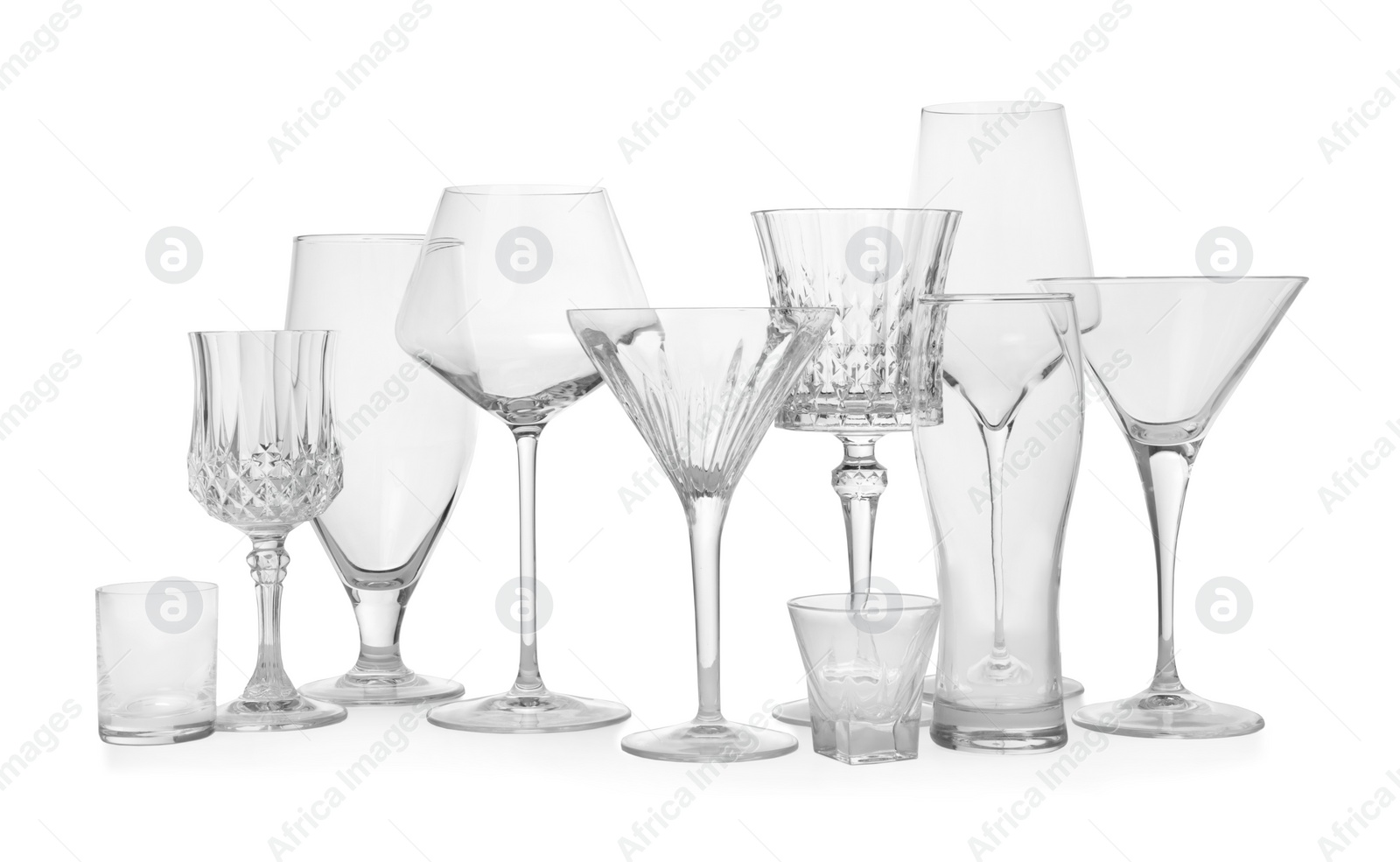 Photo of Different elegant empty glasses isolated on white