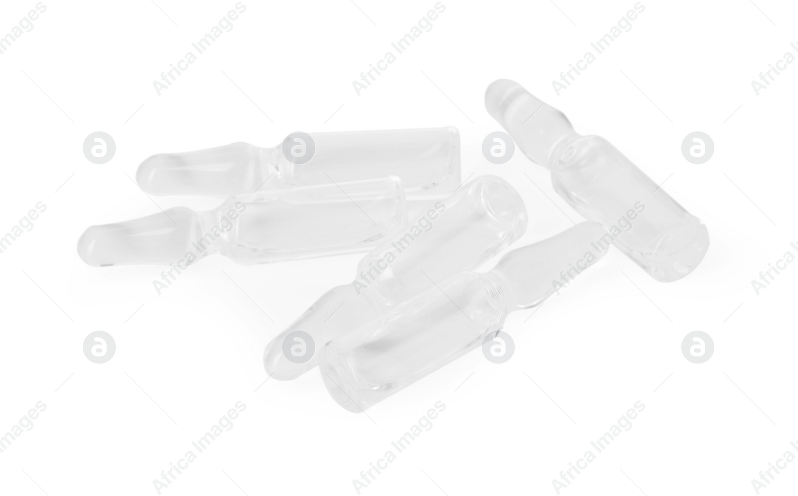 Photo of Glass ampoules with liquid isolated on white, above view