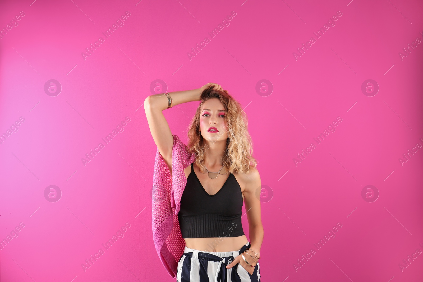 Photo of Beautiful young woman posing on color background. Summer fashion