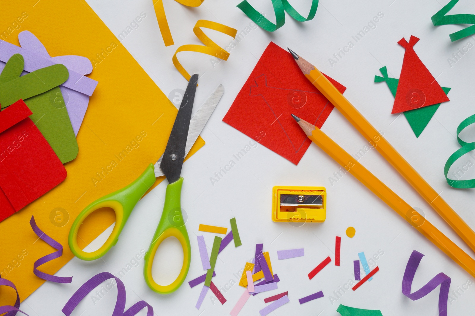 Photo of Flat lay composition with stationery, confetti and paper gift boxes on white background