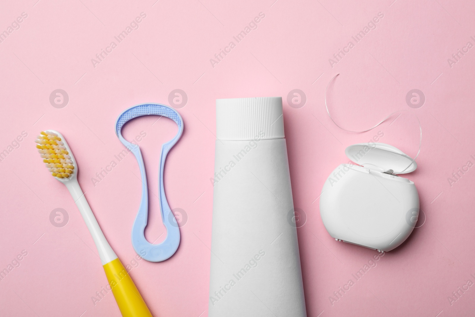 Photo of Flat lay composition with tongue cleaner and teeth care products on color background