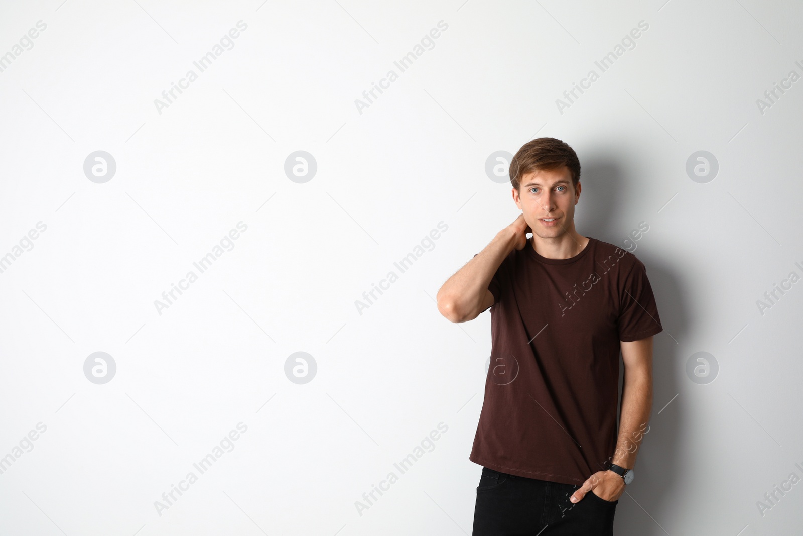 Photo of Portrait of handsome man on light background. Space for text