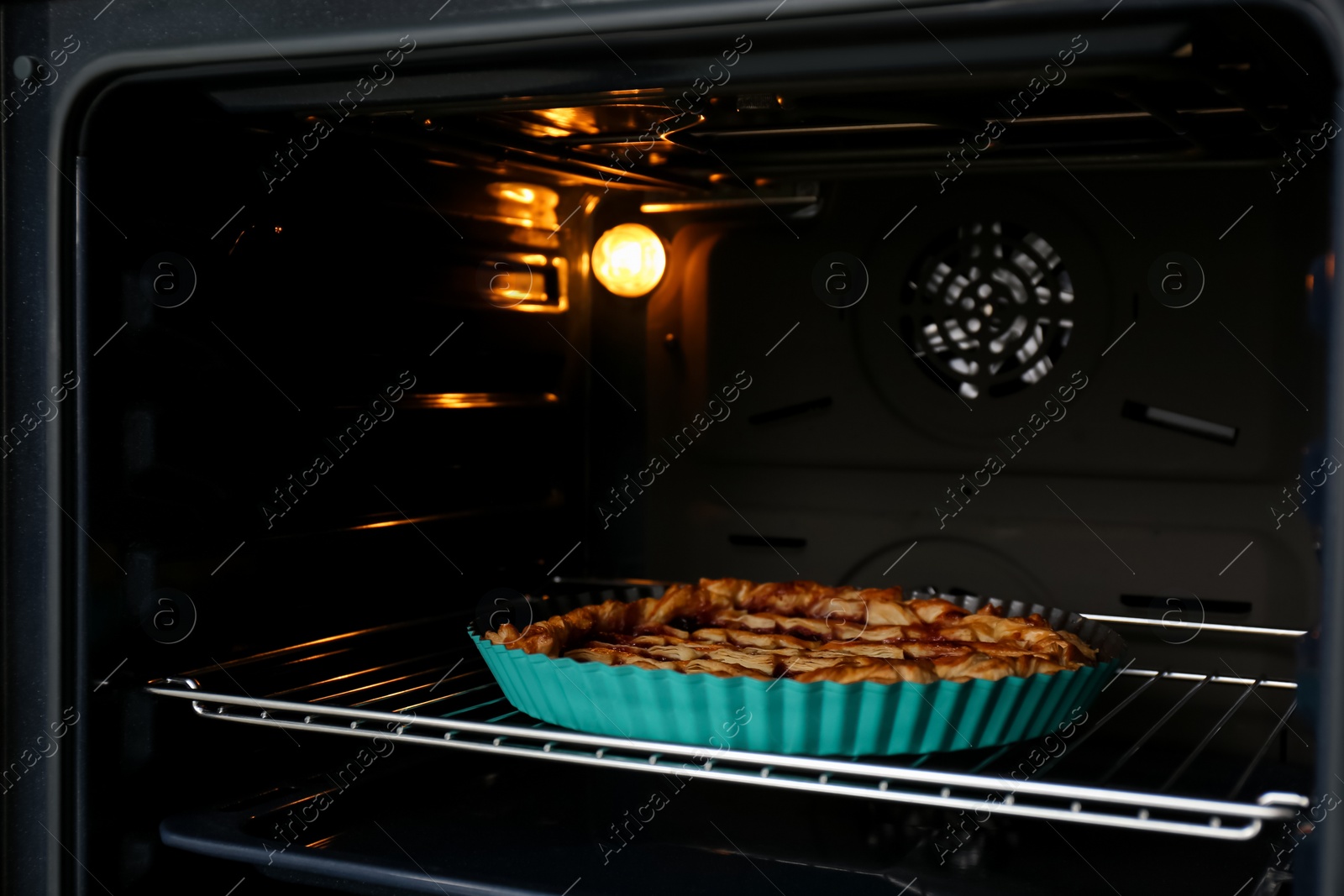 Photo of Delicious fresh homemade cake in modern oven