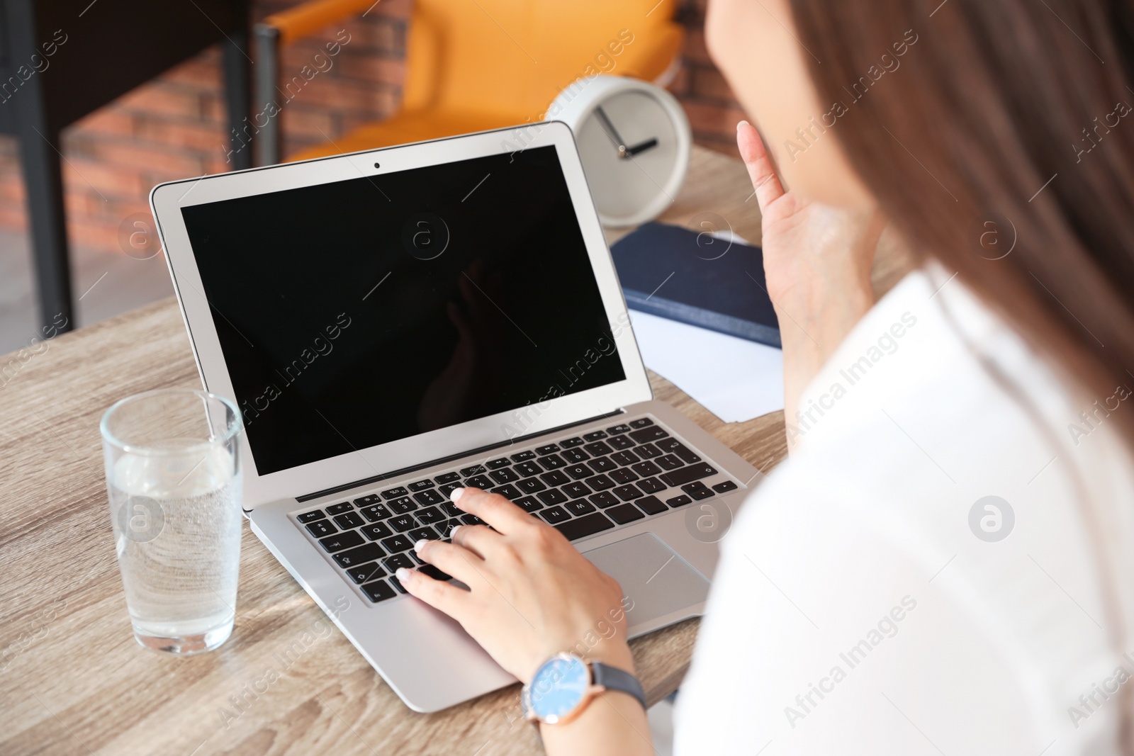 Photo of Woman using video chat on laptop in home office, closeup. Space for text