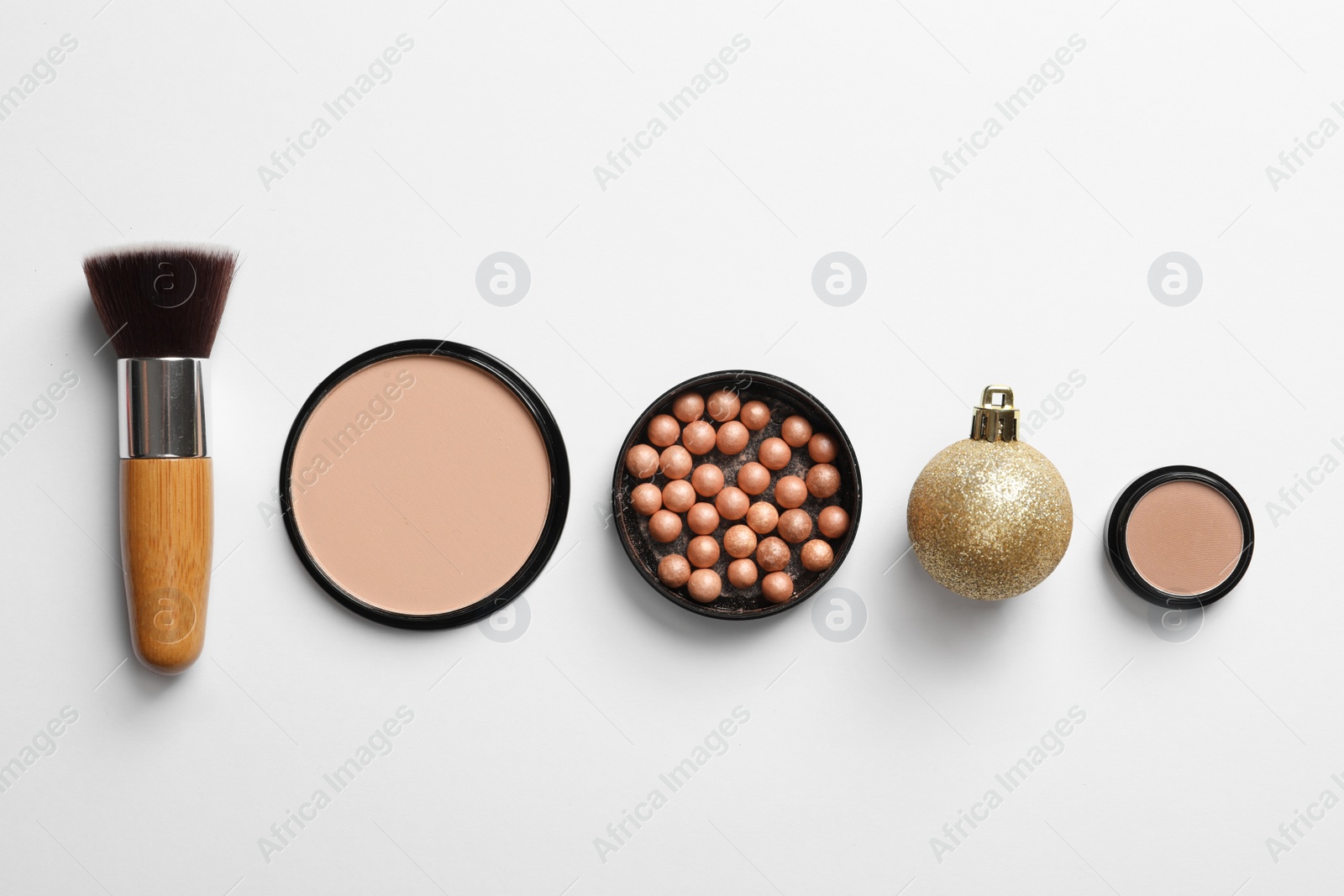 Photo of Flat lay composition with makeup products and Christmas decor on white background