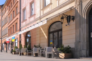 Photo of WARSAW, POLAND - MARCH 22, 2022: Beautiful view of modern cafe with outdoor terrace